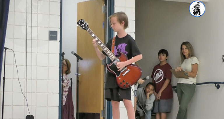 11-year-old Julian rocks out to AC/DC at school talent show