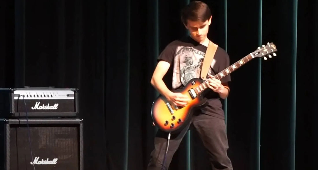 Guitar Riff Master Brendan Jones Captivates High School Talent Show With Medley